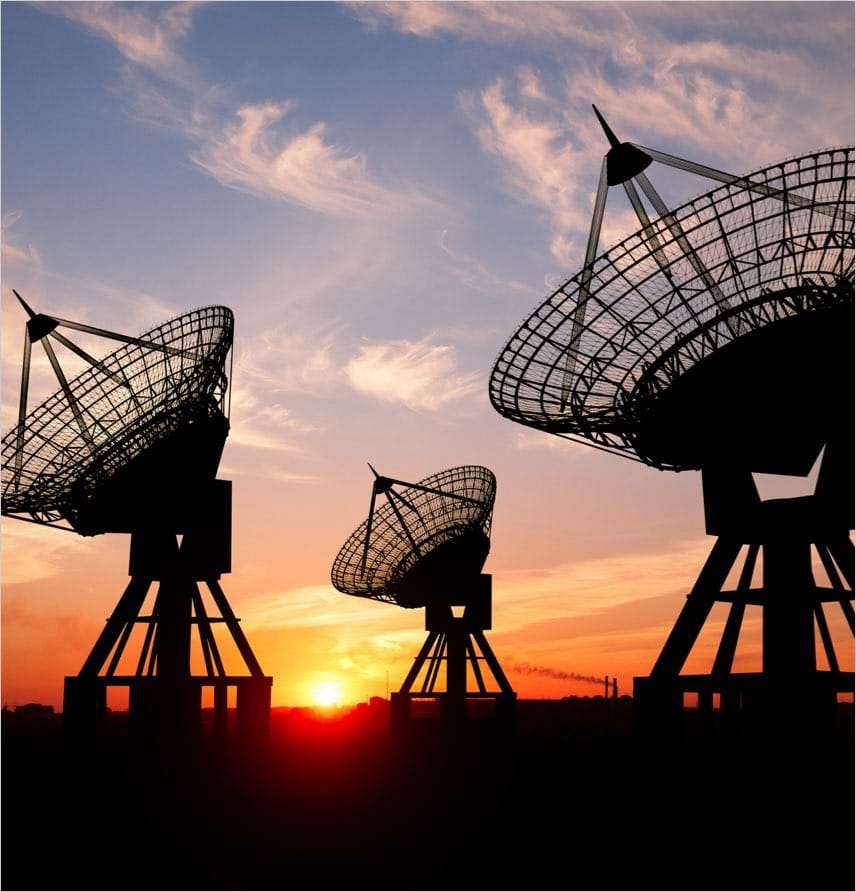 Radio telescopes with sunset in background